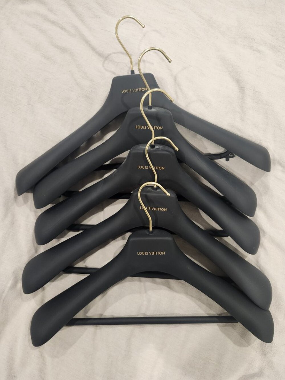 Set of 5 authentic Louis Vuitton hangers